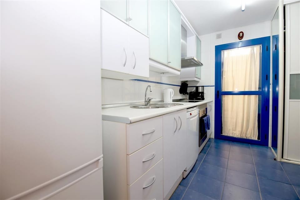 Fully fitted kitchen with laundry room to the rear