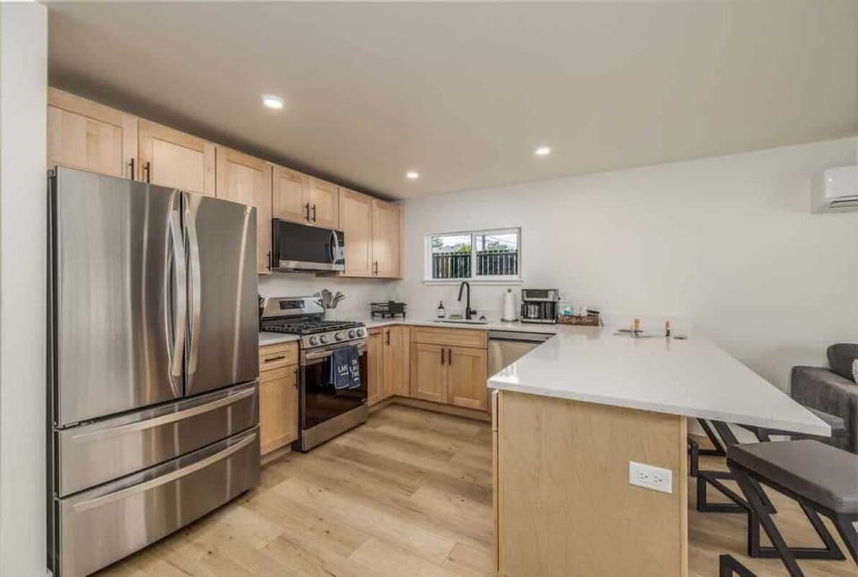 Big open kitchen with modern appliances and fully stocked 