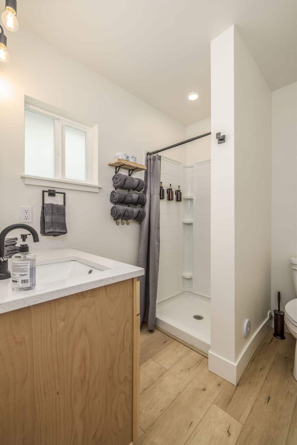 Bathroom with shower, soaps, hair dyer etc 
