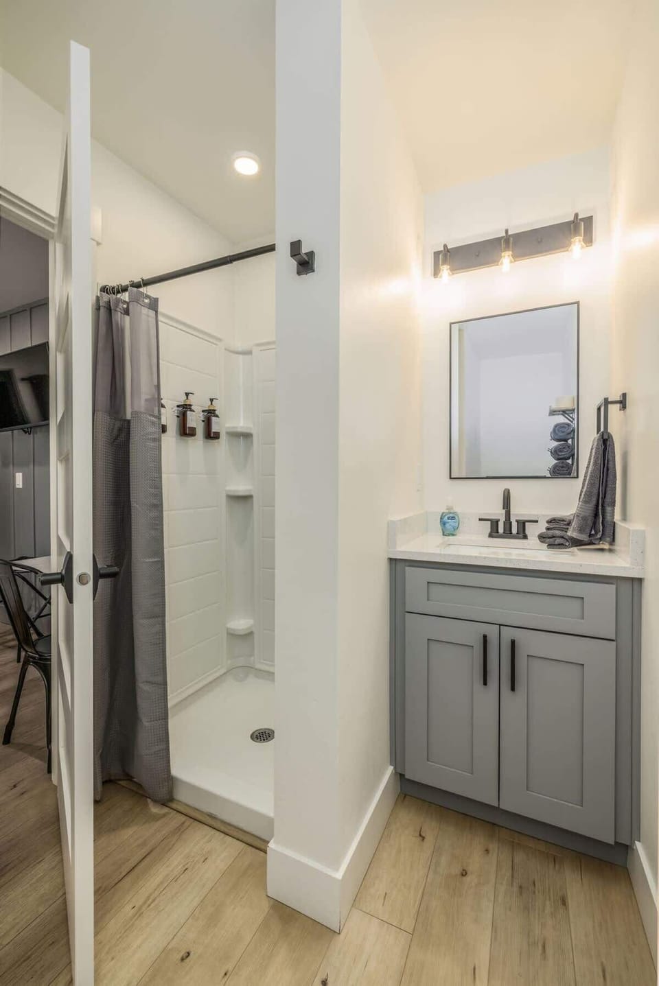 Bathroom with shower, soaps, hair dyer etc 