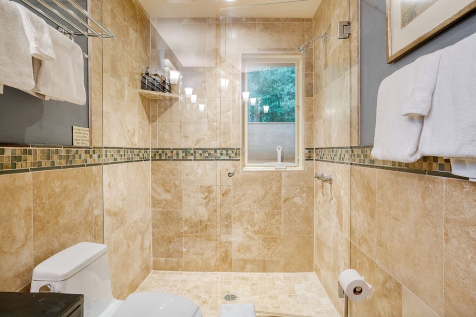 Bathroom 1 offers a shower.