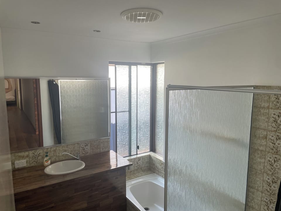 Bathroom. One of 2 at house. This one has shower and bath.