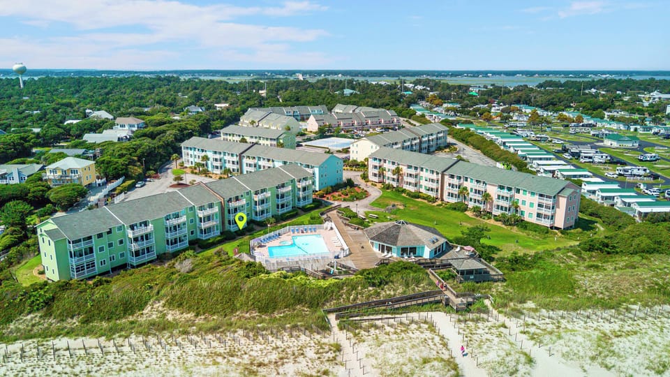 Condo's balcony is pool front and you can hear the ocean right from it. 