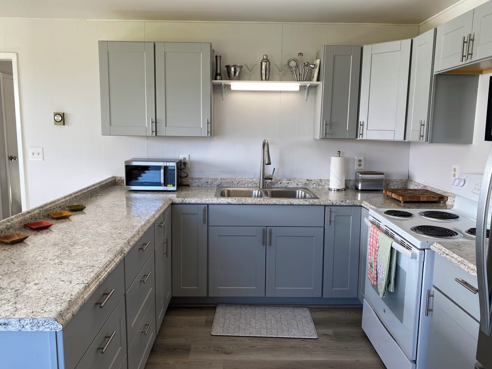 Everything you need for cooking - ample cookware, plateware and utensils.