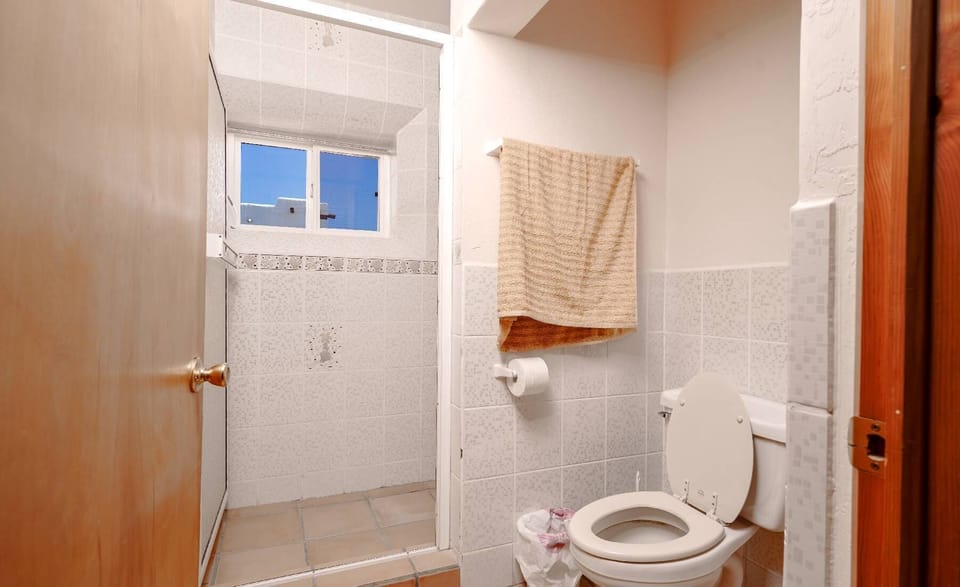 The first full bathroom at Casa Susie serves the main living areas and bedrooms — clean and functional for your group