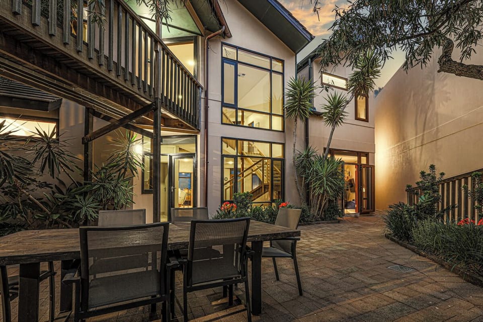 Seascape exterior in the evening, alfresco area lit up