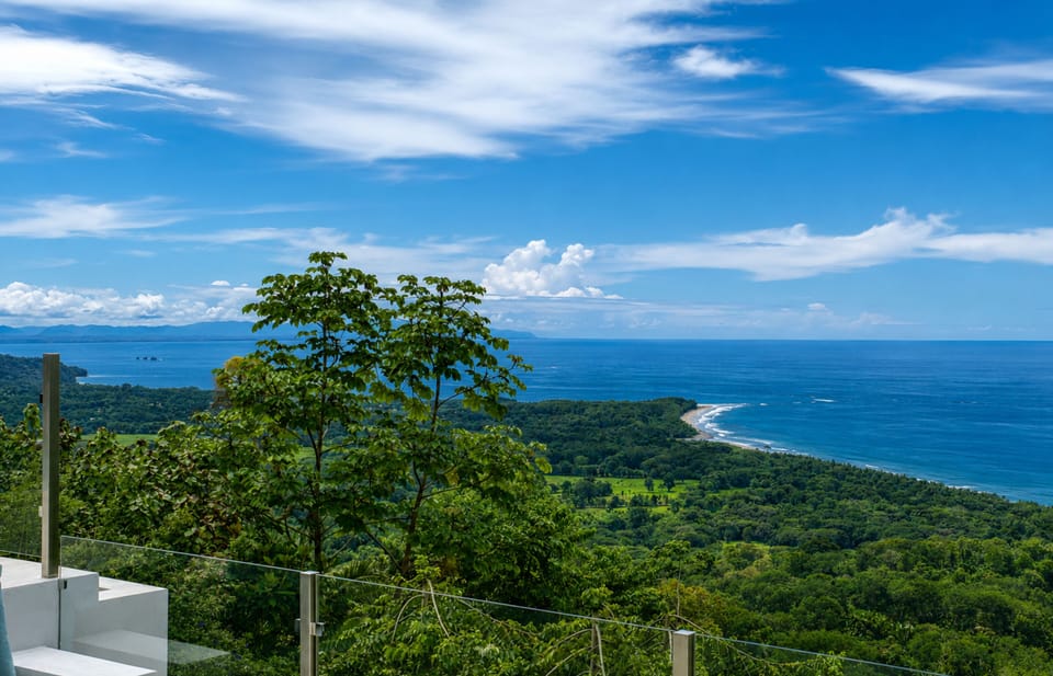 Sweeping Pacific views framed by lush jungle and Costa Rica’s spectacular coast