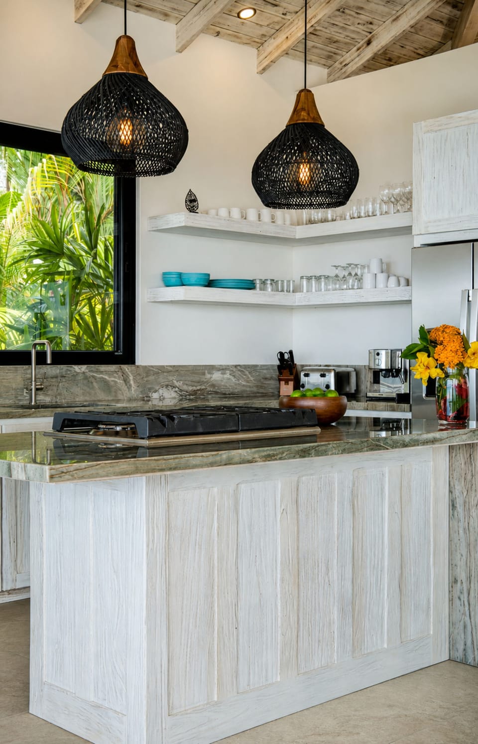 A bright tropical kitchen with natural textures and lush garden views.