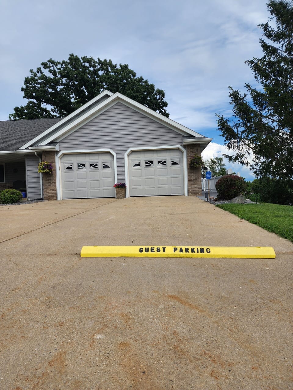 Free Guest Parking spot on concrete driveway