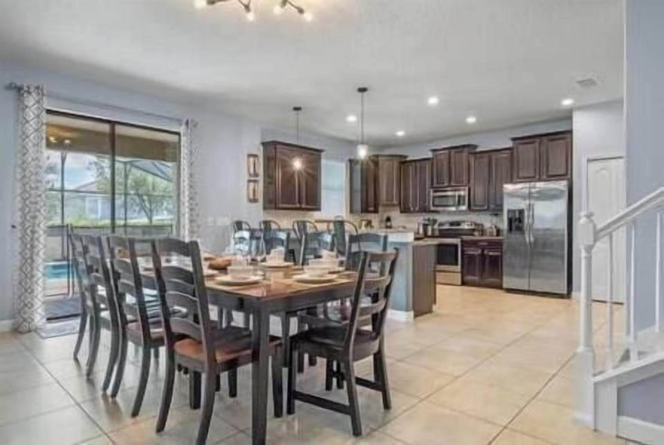 Large dining area attached to living room with plenty of comfortable seating.