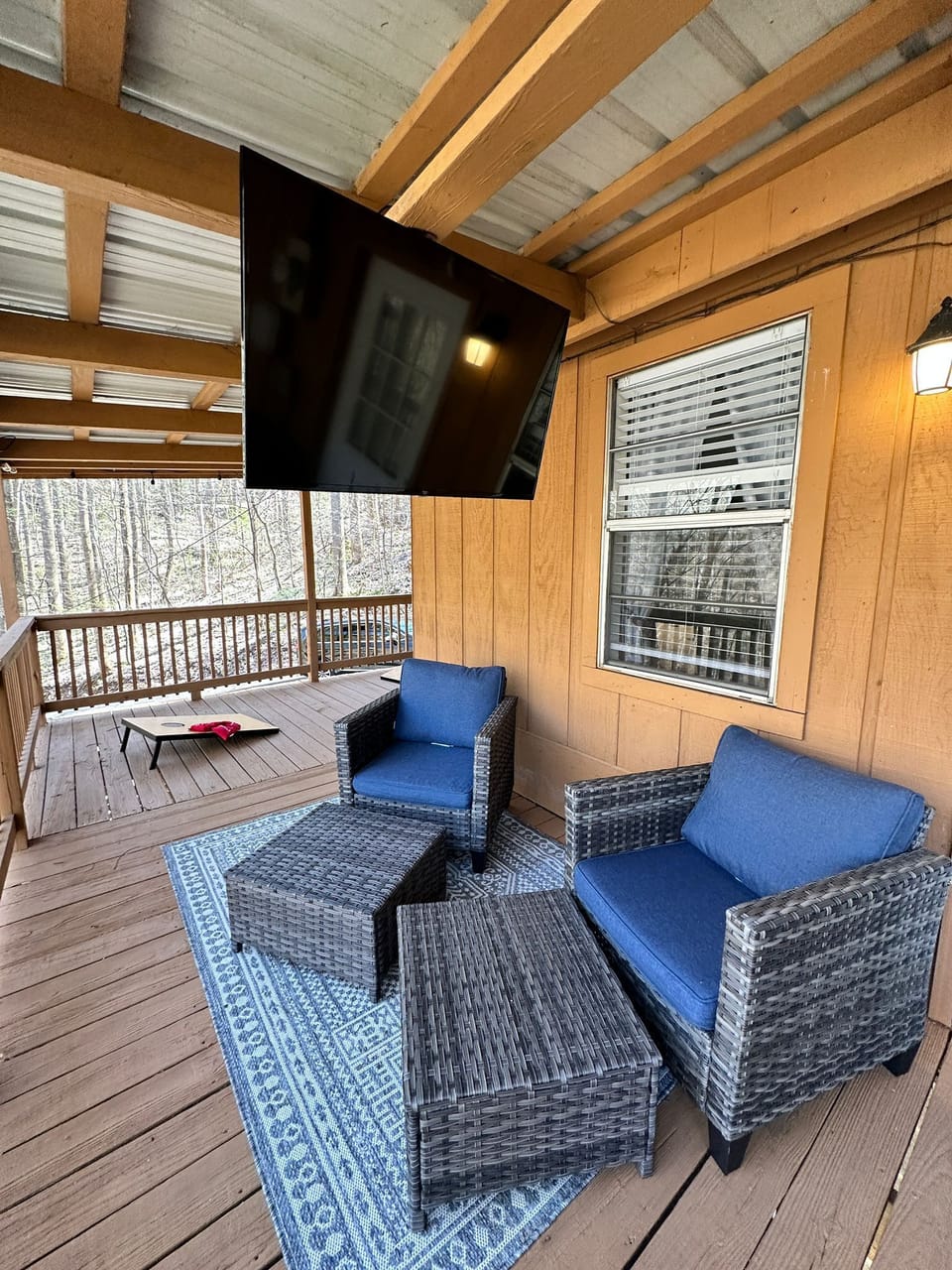 Quality Outdoor furniture, TV by the hot tub, and cornhole outside