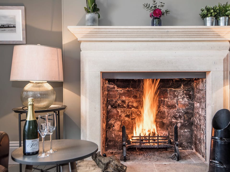 Charming and warm living room with open fire | The Manor House, Syderstone, near Fakenham