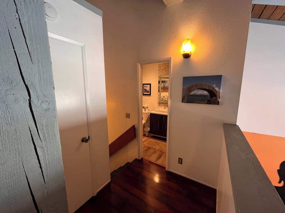 Loft bathroom and stairs to studio below
