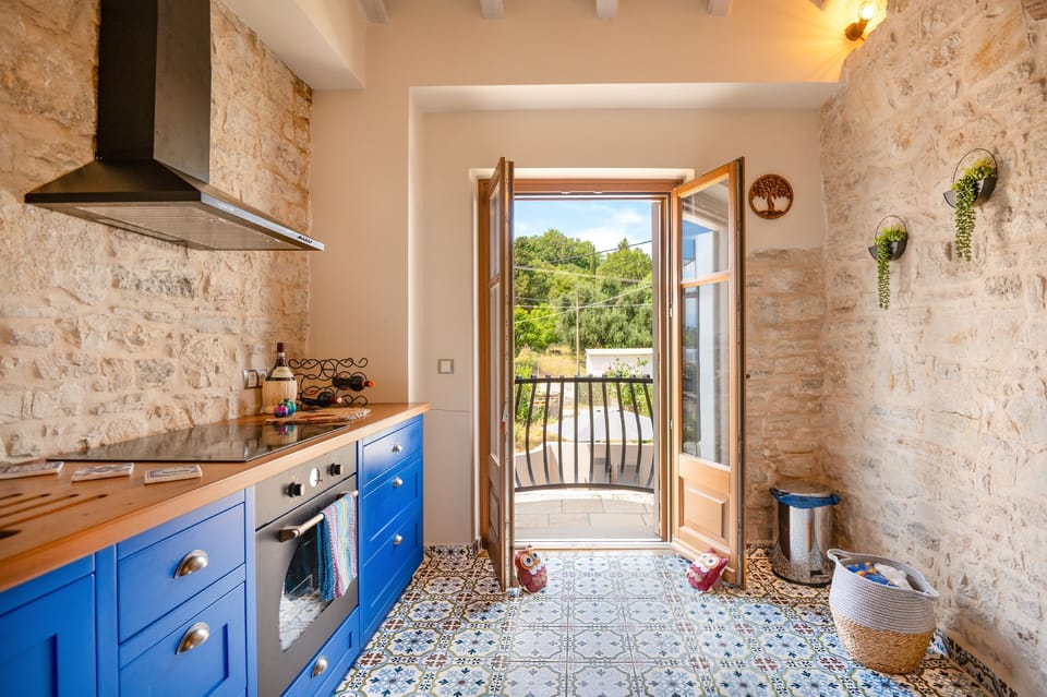 Kitchen with a balcony and countryside views