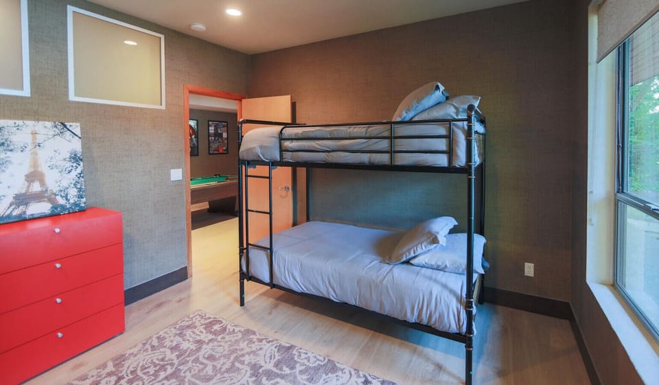 Bunk bed room, direct lake view, total of two sets, twin size mattresses, total of four. Directly across from full bath with a walk in shower.