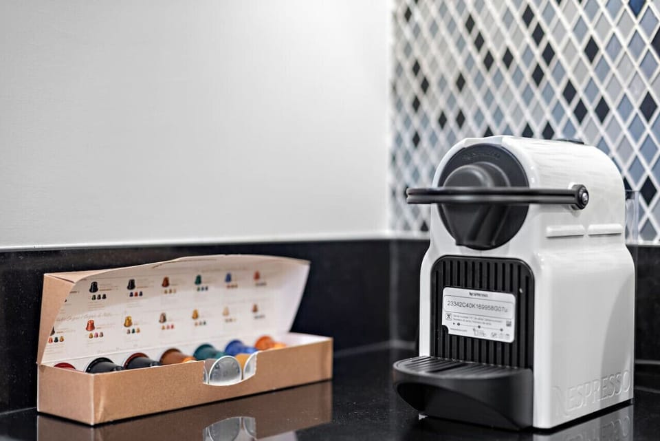 Coffee Corner: Brew your morning magic with our top-of-the-line Nespresso machine and pods!
