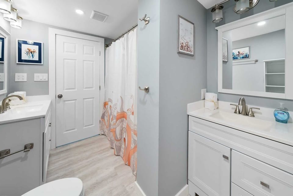 Bathroom 2 Features Two Vanities, Shower/Tub Combo
