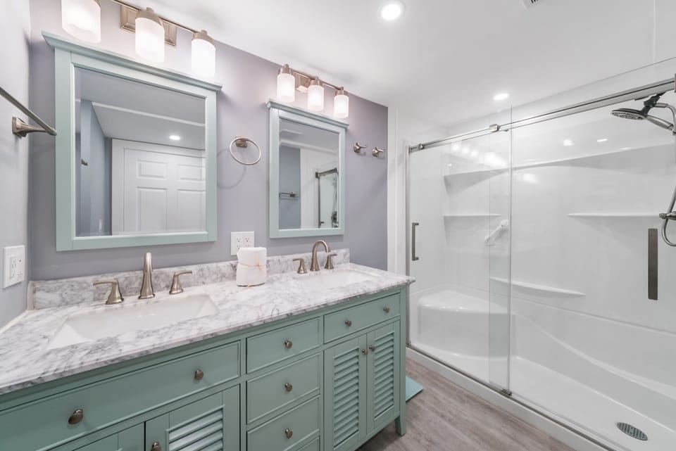 Bathroom 1 Features a Double Vanity, Stand up Shower