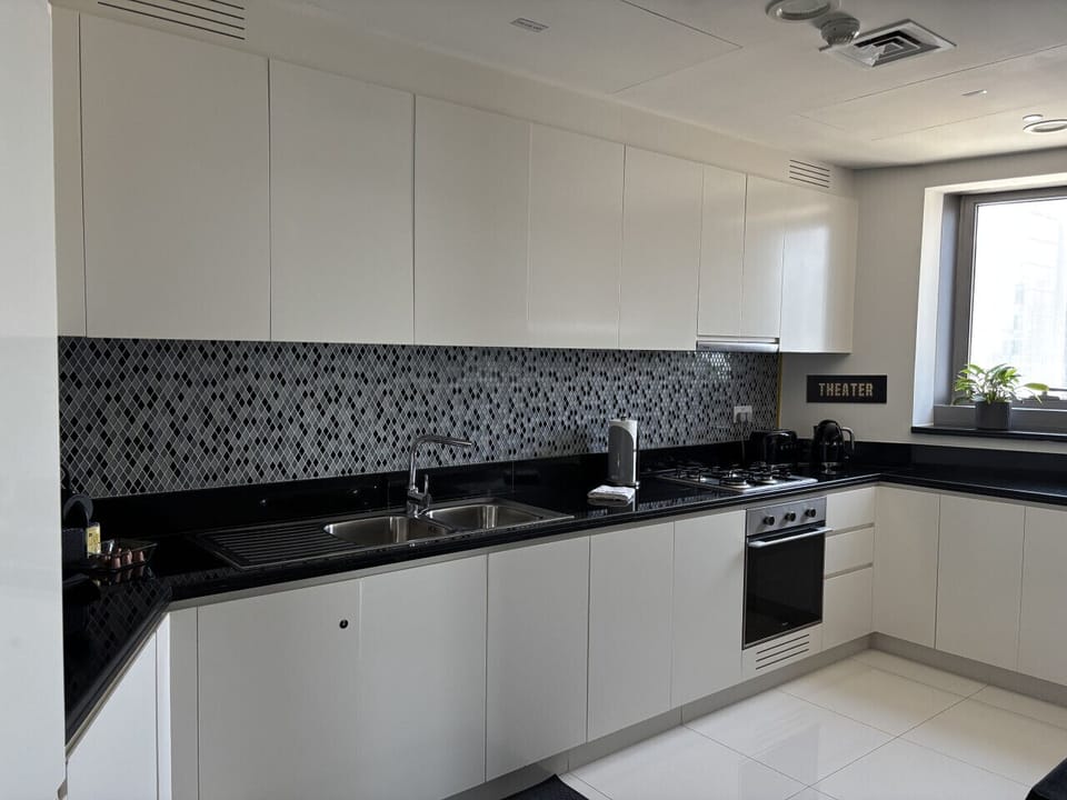 Fully equipped kitchen with washer/dryer, stove, oven, and Dishwasher
