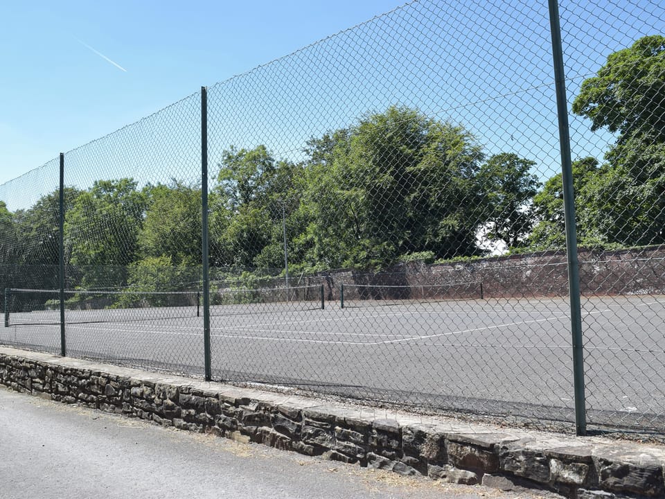 Tennis courts | Sunnybank Lodge, Llanfynydd