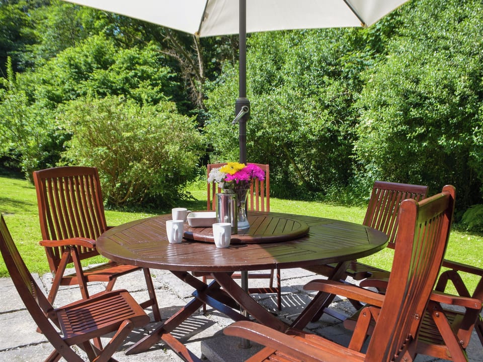South facing patio dining | Wood Cottage, Stackpole Cheriton, near Pembroke
