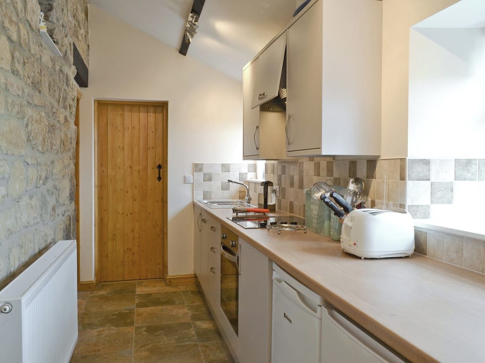 Galley style fitted kitchen | Curlew Cottage, Belford, near Bamburgh
