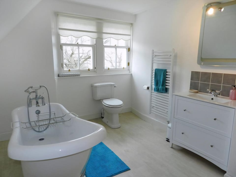 Bathroom with roll-top bath | Craegard House, Corrie, Isle of Arran