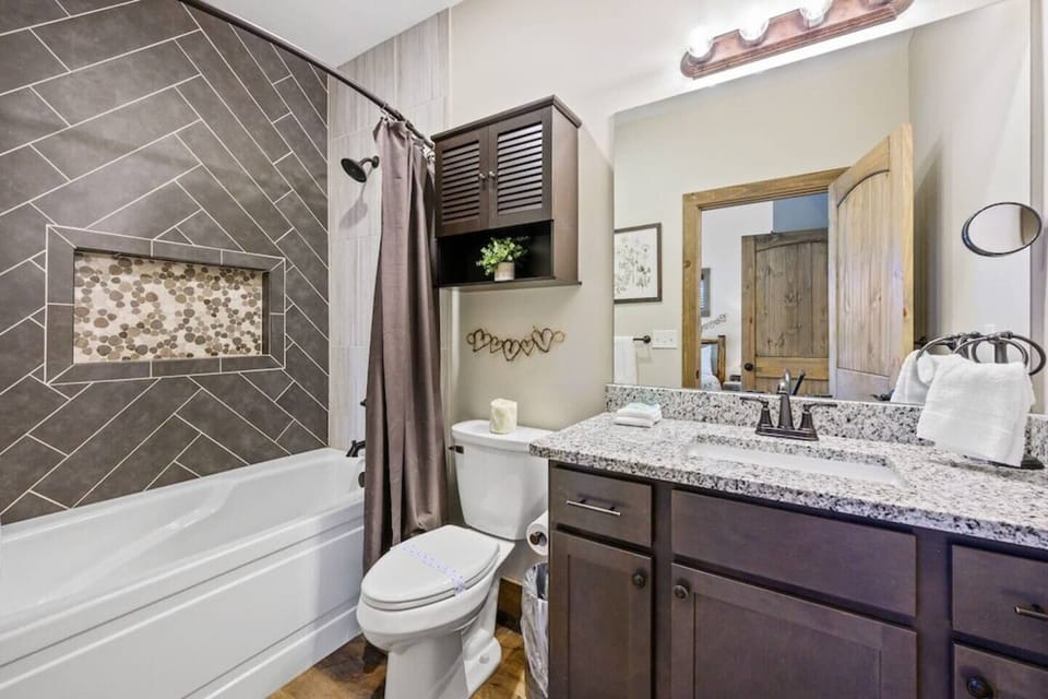 Spacious entry level master bathroom with bathtub!
