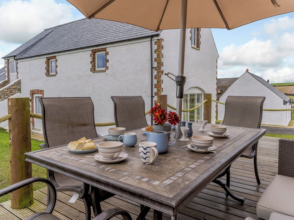 Decked patio area | The Cornstore - Musselwick Farm, St Brides
