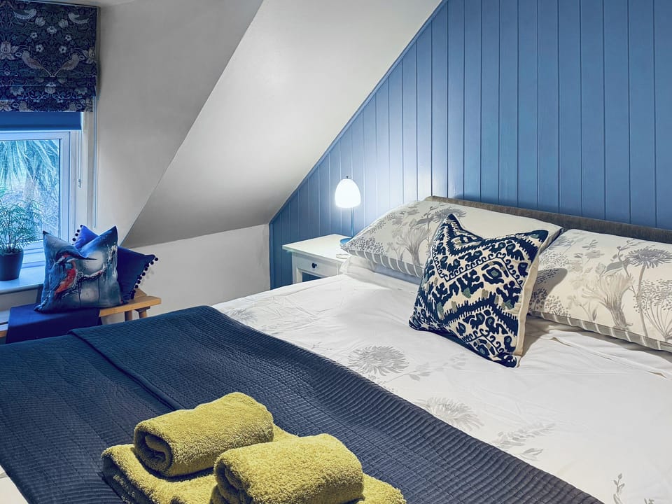 Beautifully decorated double bedroom with kingsize bed | 2 Northbank Cottages, Whiting Bay, Isle of Arran