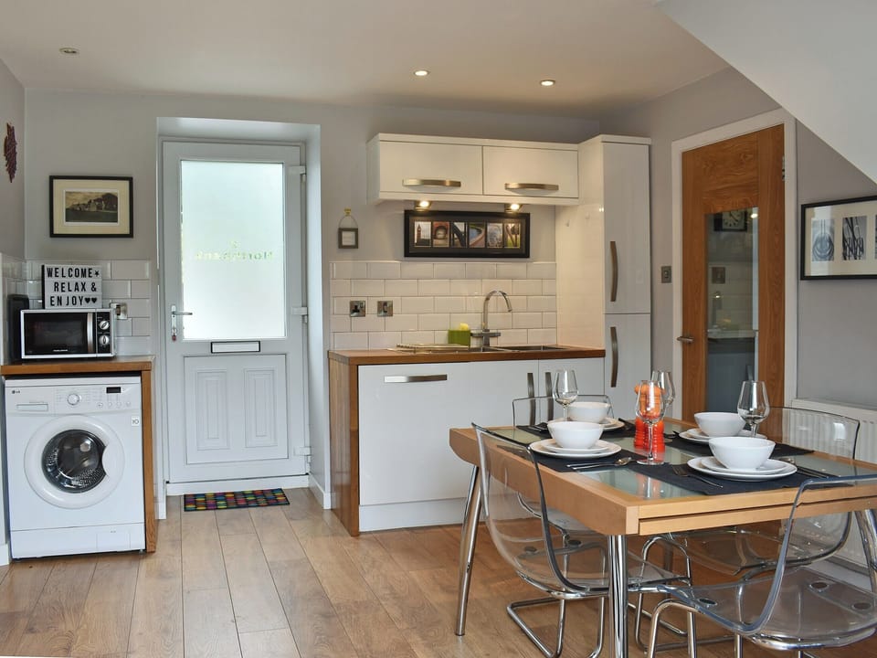 Light and airy kitchen/dining room | 2 Northbank Cottages, Whiting Bay, Isle of Arran