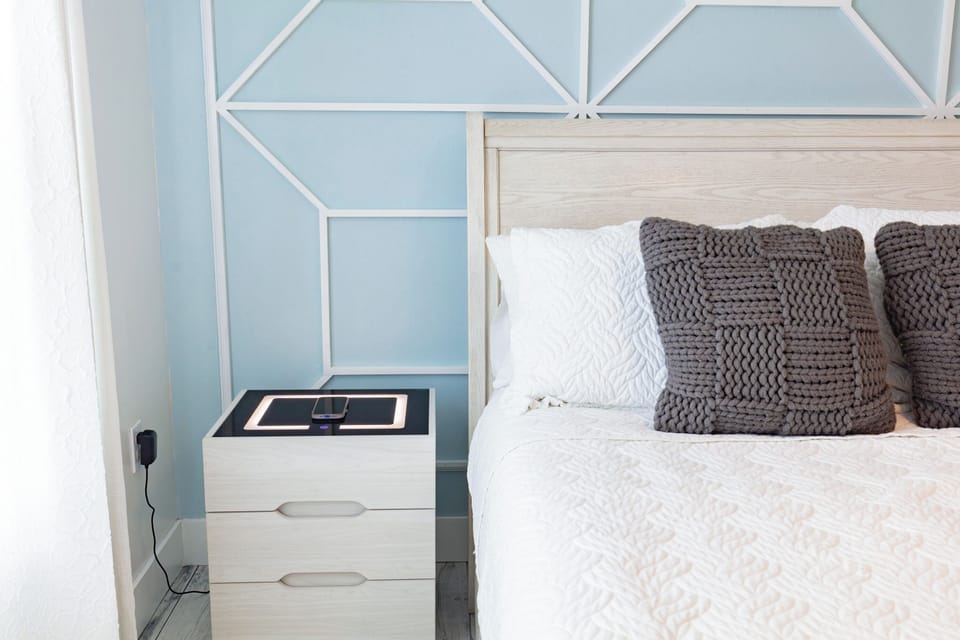 Comfort is our priority! 1 Queen bed is available for our guests with lots of natural light, want to sleep in? no problem!! all of our bedrooms will offer you black out cellular blinds and curtains. Nightstand with charging station and light  