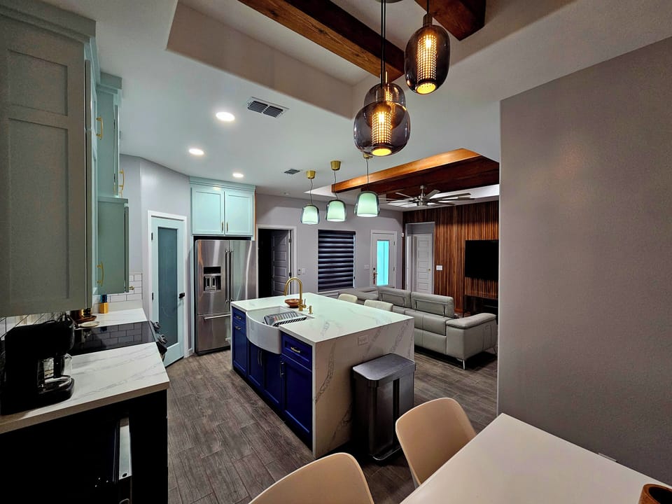 Open entertaining  living concept 
Kitchen has basic pots, pans, kitchen items