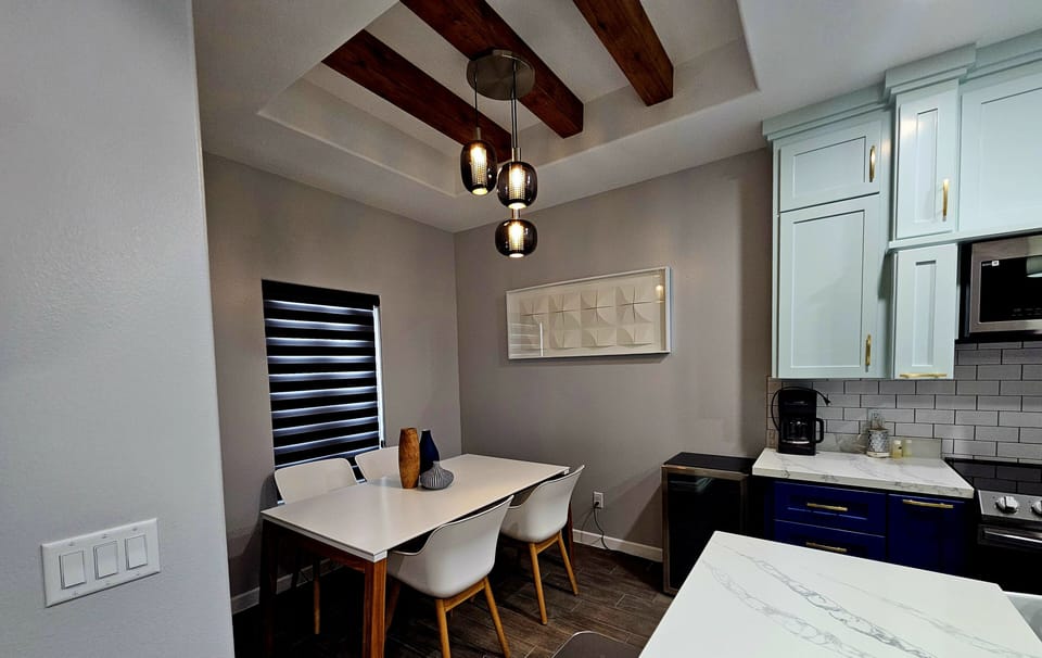 Dining table sits 4 and extra chairs in counter top 