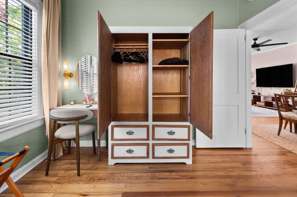 Antique Armoir for clothes storage and vanity nook for extra space getting ready. 