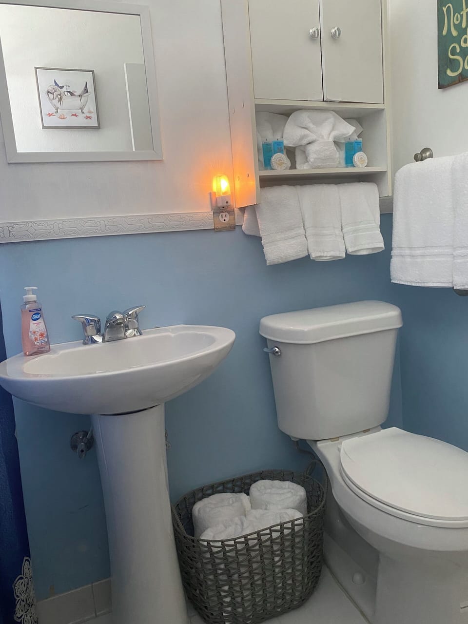 Bathroom with pedestal sink. 