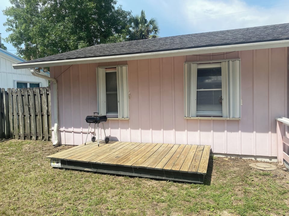 Back yard offers a deck w/ grill & fenced yard for privacy and furry friends.