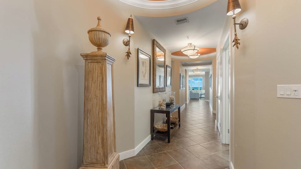 View from entrance to living room and private balcony.