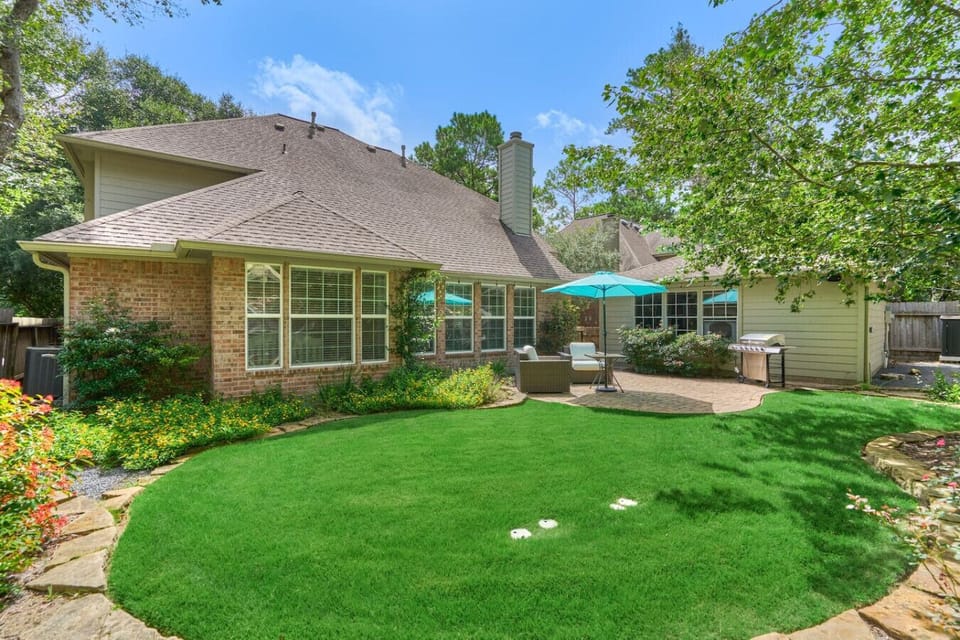 Plenty of room to relax or play in the fenced backyard.