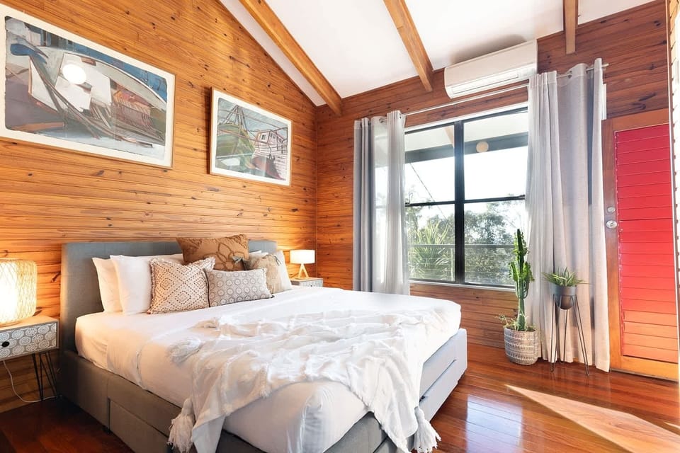 Master bedroom with king bed and balcony access