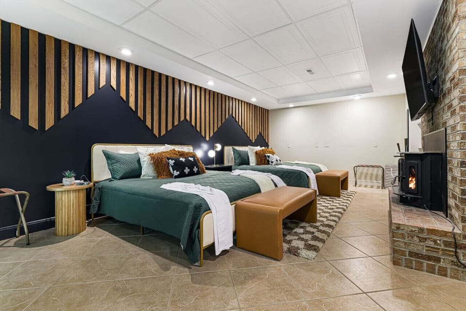Downstairs bedroom with two king beds and a fireplace