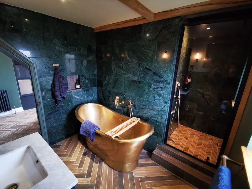 Bathroom with Brass Bath tub