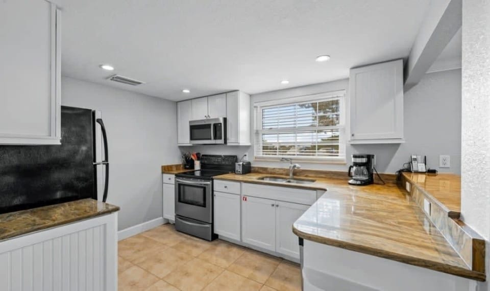Full Kitchen with dishes, utensils, pots, pans, toaster, coffee maker, slow cooker, dishwasher 