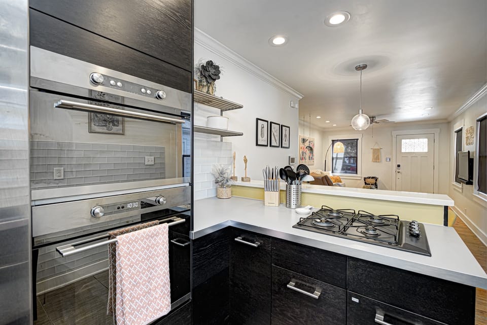 Spacious kitchen with microwave, oven, & gas cooktop