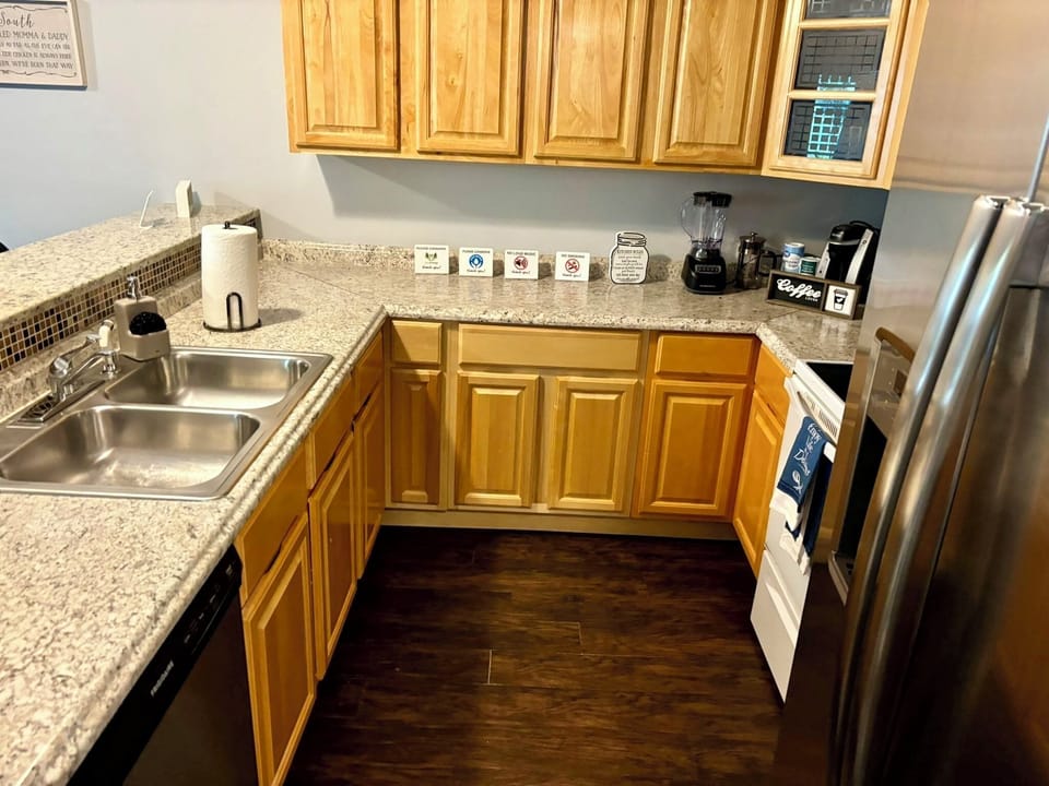 Kitchen Delight: Modern appliances shine against granite countertops, perfect for culinary adventures!