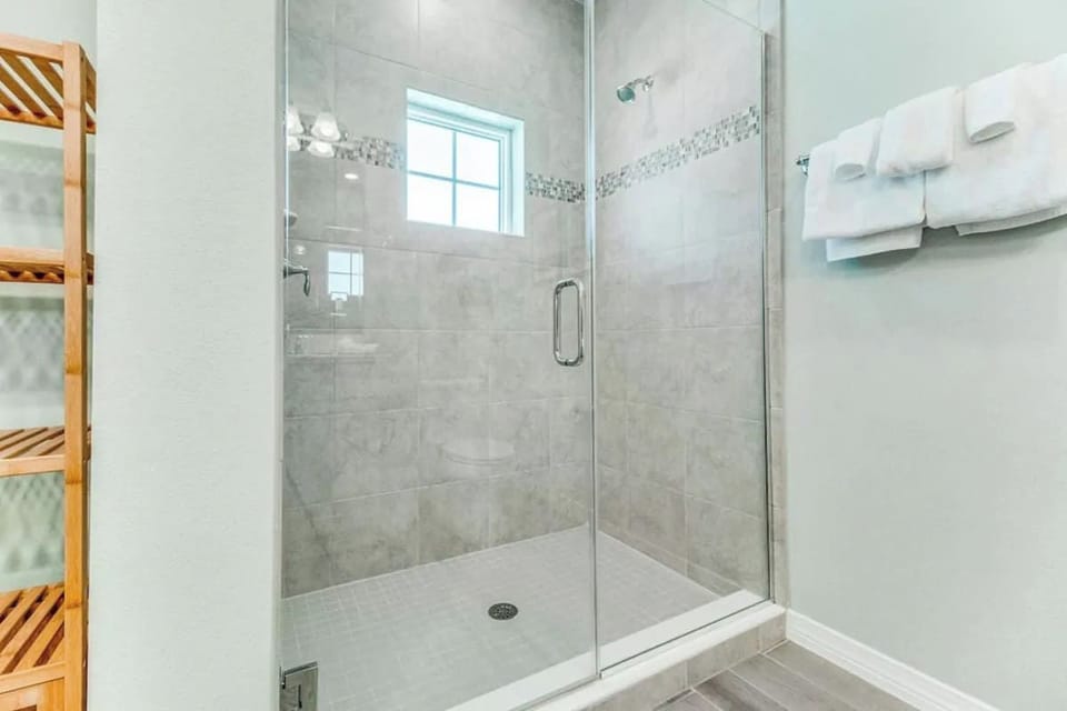 Master bath shower provides a luxury adjustable shower head SPA spray.