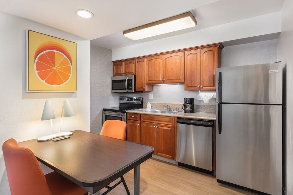 Cook easy meals in a full kitchen with stainless appliances.