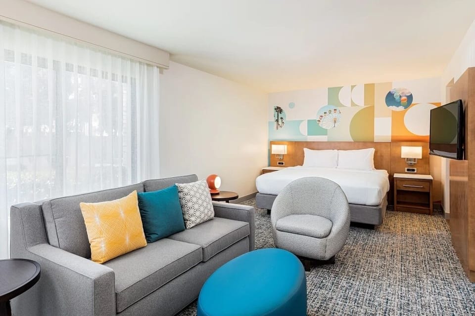 Stretch out in a sunlit suite with lounge seating.