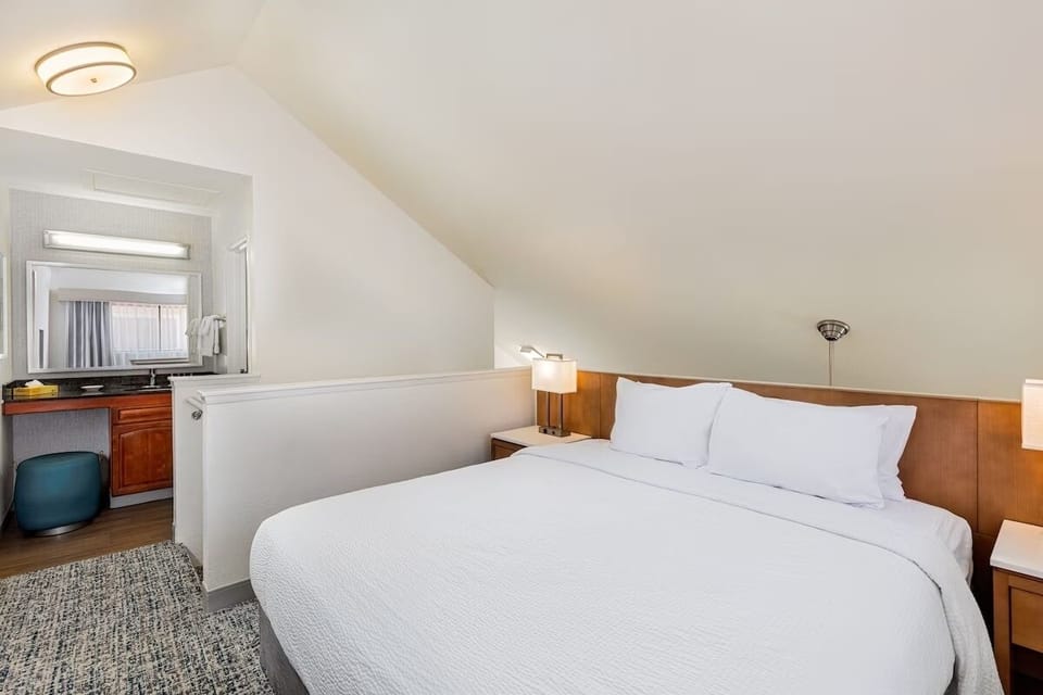 Drift off fast in a tucked-away bedroom with warm lighting.