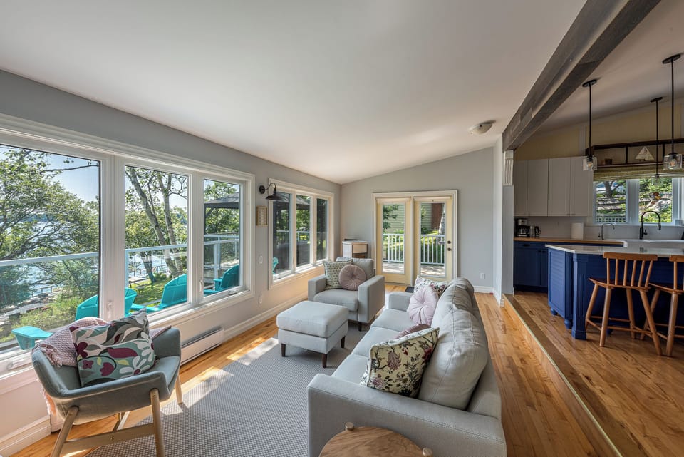 Living Area with Expansive Views of Prospect Bay +  55' Smart TV